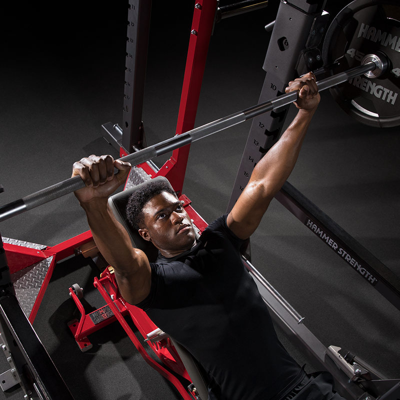 Bench pressing with Hammer Strength Olympic Barbell