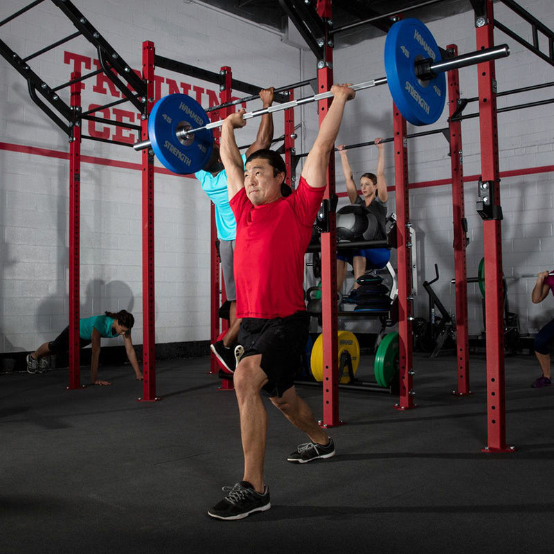 Shoulder press with stainless steel Hammer Strength barbell