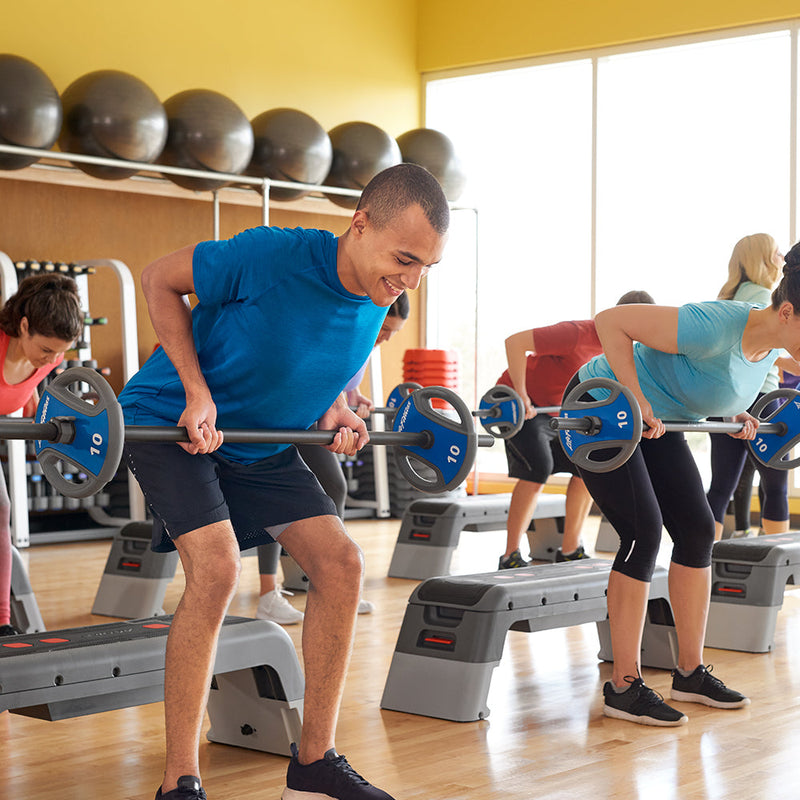 Exerciser rowing studio barbell and plates